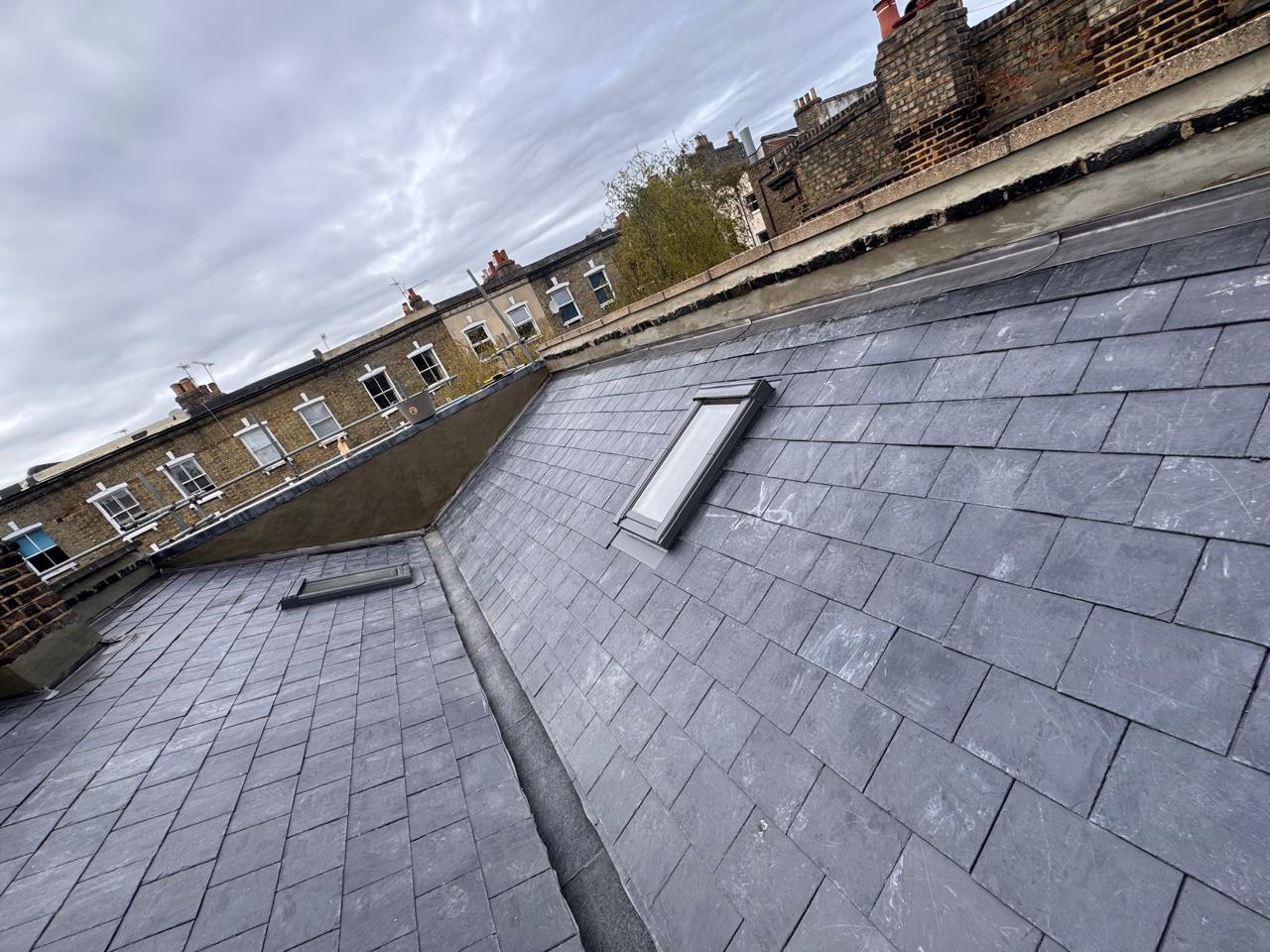 Completed slate roof with two Velux skylights — North London