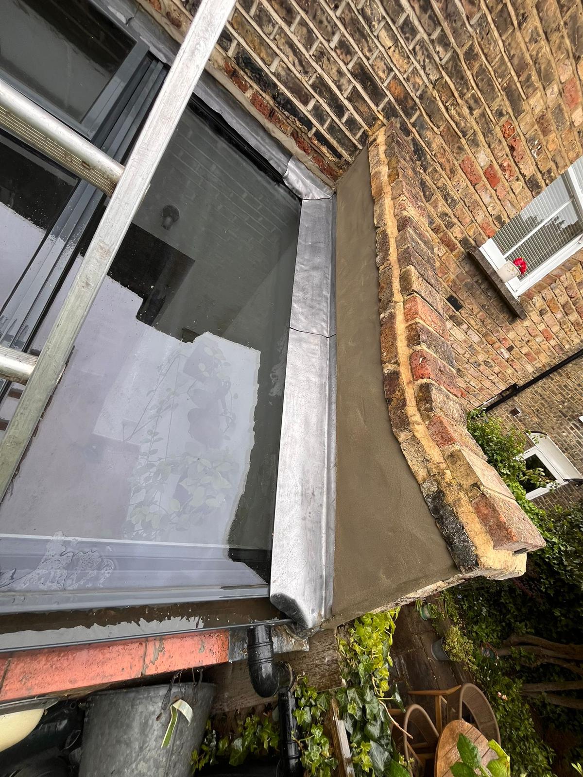 Lead flashing and render detail on Victorian property