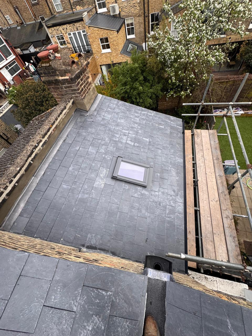 New slate roof from above with skylight