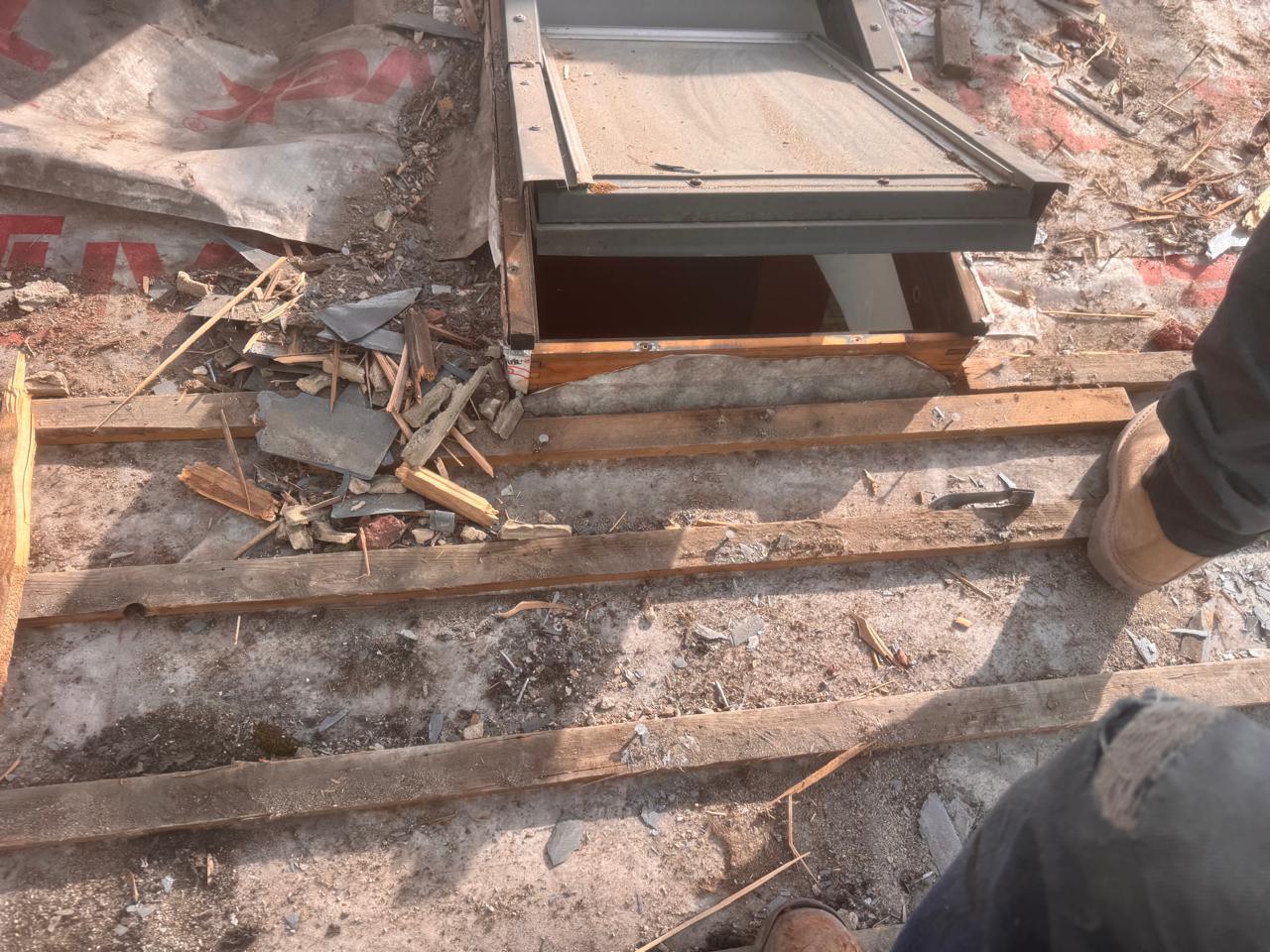 Old roof stripped back showing skylight opening